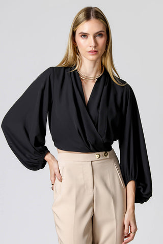 Blusa cruzada con mangas largas abullonadas - NEGRA